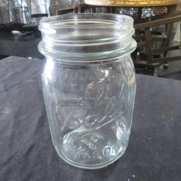Clear glass Pint Mason Jar by Ball, vintage design, embossed logo, excellent condition, no lid, collectible kitchenware.
