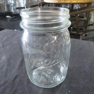 Clear glass Pint Mason Jar by Ball, vintage design, embossed logo, excellent condition, no lid, collectible kitchenware.