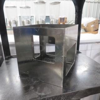 Rosetto Stainless Steel Riser, model 5XBID, square design, used condition, visible surface wear, suitable for displays.