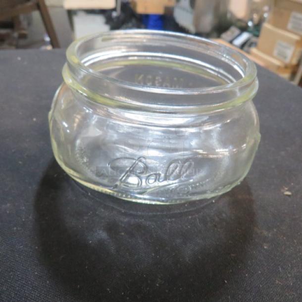 One Lot of 25 half-pint squatty Ball jars. Clear glass, embossed "Ball" logo. Collectible item, excellent condition.
