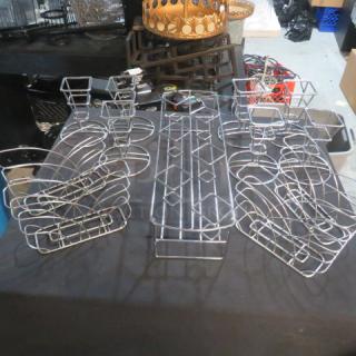 Assorted stainless steel holders lot, featuring various sizes and shapes, in good condition. Ideal for organizing spaces.