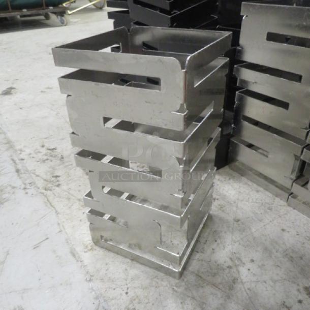 Rosetto Stainless Steel Riser, 6x12 inches, sleek modern design, excellent condition, priced at $302.82 each.