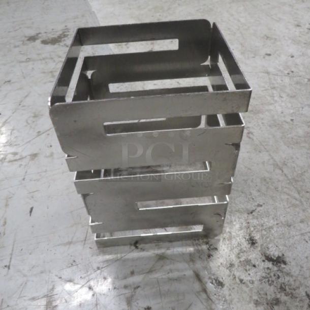 Rosetto Stainless Steel Riser, 6x8 inch, used condition, stackable with slotted design.