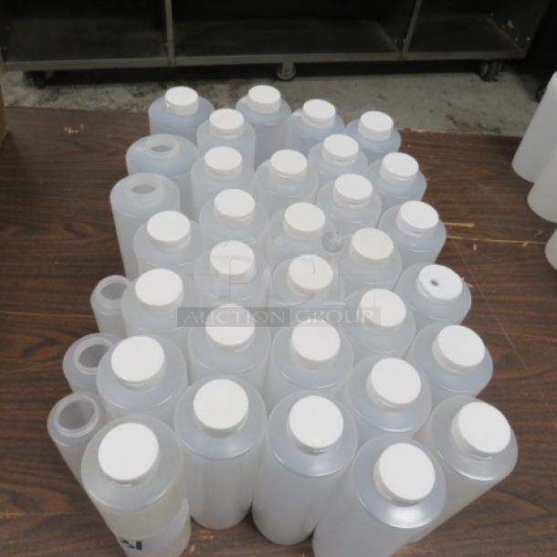 A large assortment of new squeeze bottles with white caps, arranged on a table, indicating unused condition.