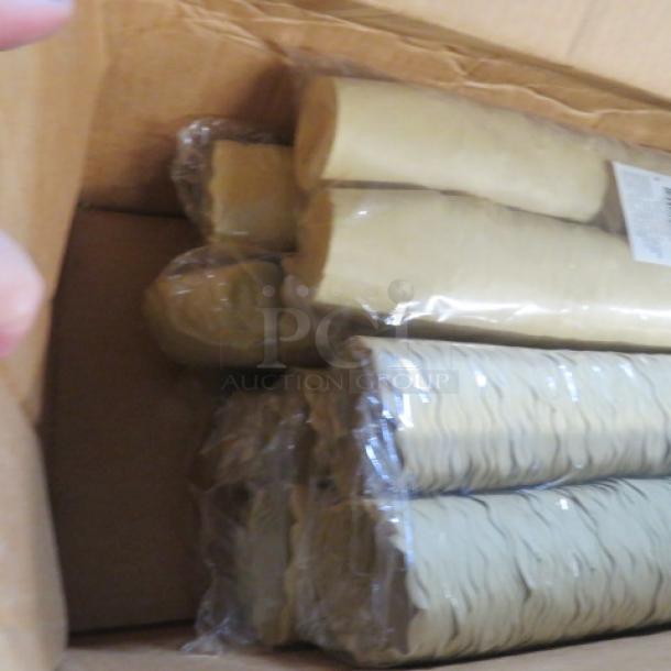 Box containing approximately 1200 paper muffin holders, packed in plastic sleeves. Holders appear in good condition.