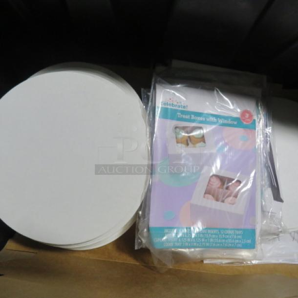 Lot of bakery paper items including round cake boards and treat boxes with windows. New condition, Celebrate brand.