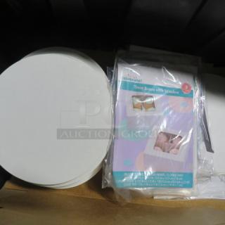 Lot of bakery paper items including round cake boards and treat boxes with windows. New condition, Celebrate brand.