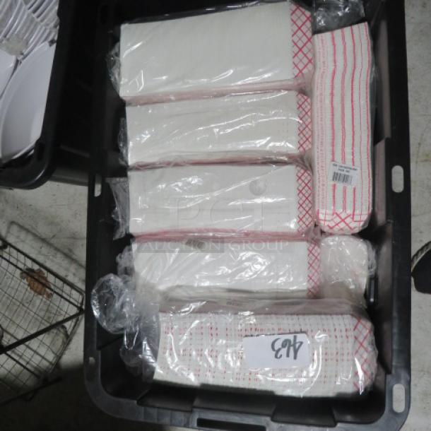 Large collection of small red and white paper boats in a storage bin, wrapped in plastic. Item number 463 visible. Ideal for bulk use.