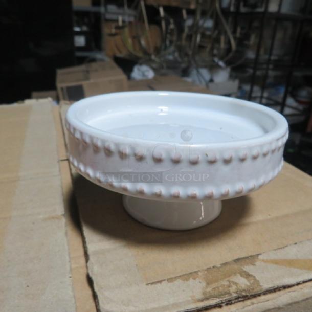 White ceramic mini cake stand with beaded edge design, Model 6XBID, in good condition, displayed on cardboard.