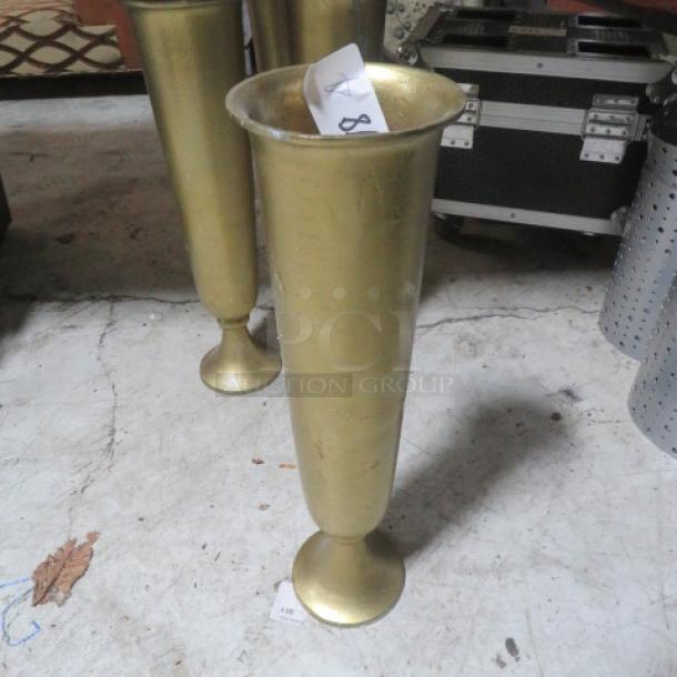 Gold vase, model 4XBID, tall and cylindrical with flared rim, metallic finish, good condition with small markings.
