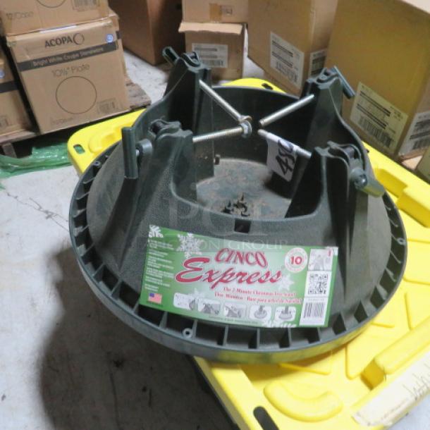 NEW 10ft Cinco Express Tree Stand in green. Includes label showing capacity and brand details. Unused, mint condition.