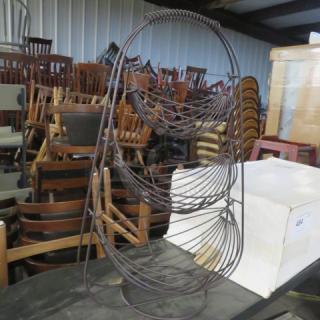 Black metal decor with three wire baskets, 13.5x11x2 inches. Good condition; ideal for organizing or display.