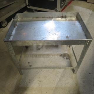 Galvanized buffet display holder, 17x12x14.5 inches, metallic finish, showing slight wear and rust. Ideal for catering.