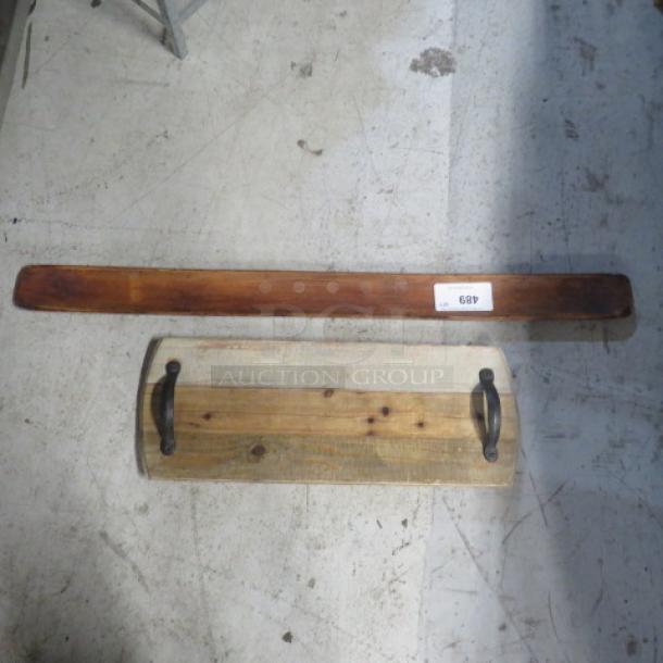 Assorted wooden decor server with rustic handles and rich patina. Includes long wooden plank with auction tag "689".
