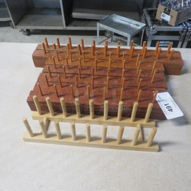 Assorted wooden decor items featuring multiple wooden peg boards, in good condition. Auction tag labeled "491" included.