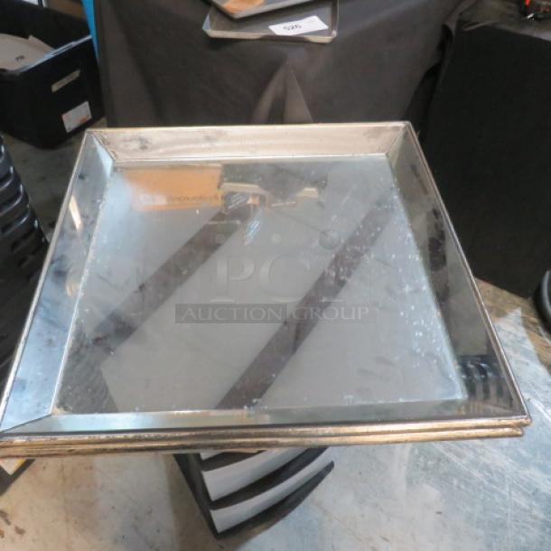 24x24 mirrored serve platter with beveled edges, reflective surface. Shows light wear, enhancing vintage appeal.