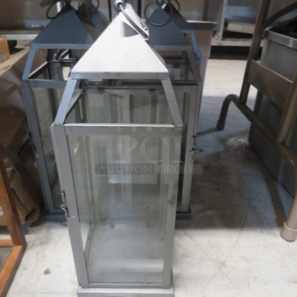 Assorted metal and glass lanterns, pyramid tops, in good condition. Ideal for decor, uses candles or LED lights.