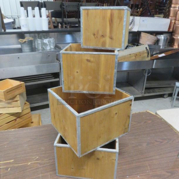Assorted wooden decor boxes, stackable, four pieces, natural finish, metal trimmed edges, good condition.
