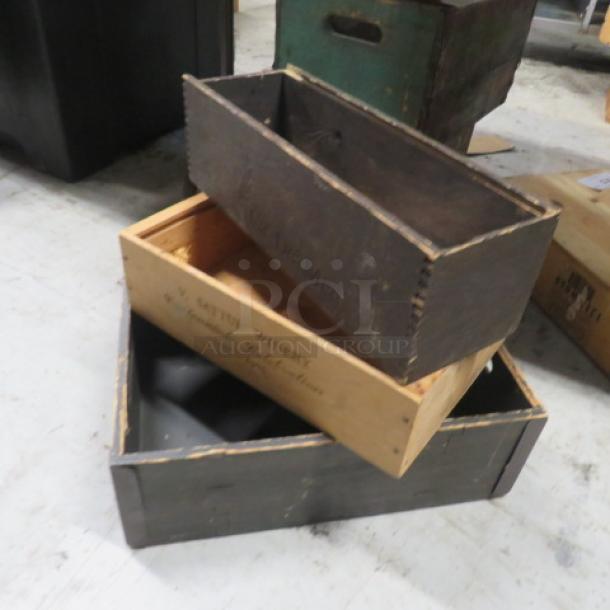 Assorted wooden decor boxes, set of three. Varying sizes, vintage patina, one marked "Smith Whiskey." Good condition.