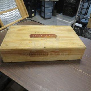 Wooden Joseph Phelps Insignia box from 2012, well-preserved with branded lid and visible vintage markings.