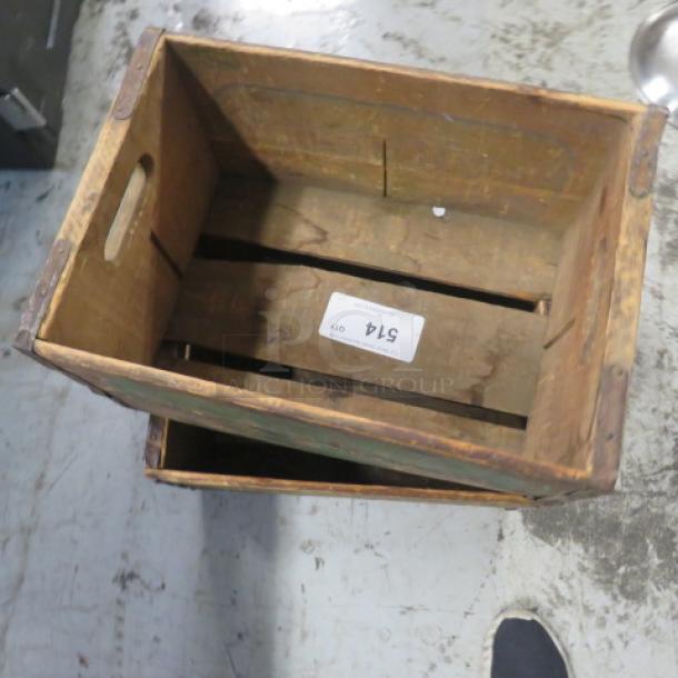 Vintage wooden box with rustic finish, open top, and cut-out handles. Slight wear visible. Label marked "514."