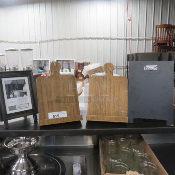 Assorted decor lot including wood cutting boards, framed photo, metal container, and glass jars. Good condition.