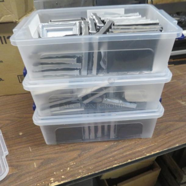 Plastic bins containing a large collection of silver picture frames in mixed conditions. Ideal for bulk purchase.