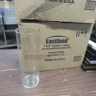 Eastland 10.5" cylinder vase, clear glass, new condition. Box labeled "Eastland, Item# 5629, Quantity (12), Made in U.S.A."