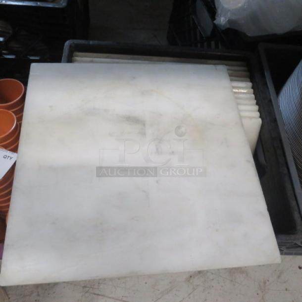 One lot of approximately 23 white marble tiles, 12x12 inches, polished finish, slight visible wear, ideal for flooring or decor.