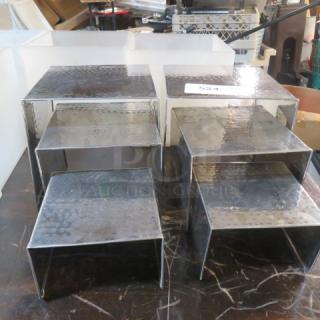 Hammered silver display stands set of six, assorted sizes, textured finish, excellent condition, ideal for retail or exhibitions.