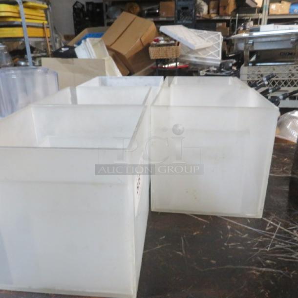 Assorted acrylic display stands in varying sizes, condition appears used, ideal for showcasing items.