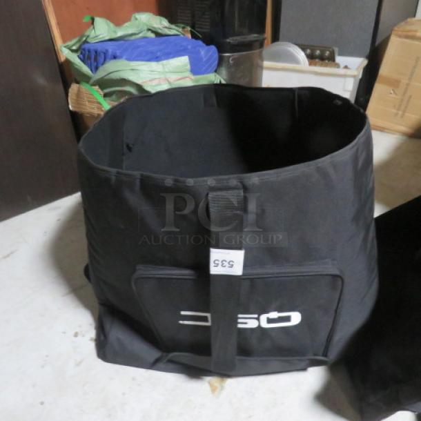 QSC XXXXL Black Equipment Bag, durable design, large capacity, with logo and tag showing "4XBID".