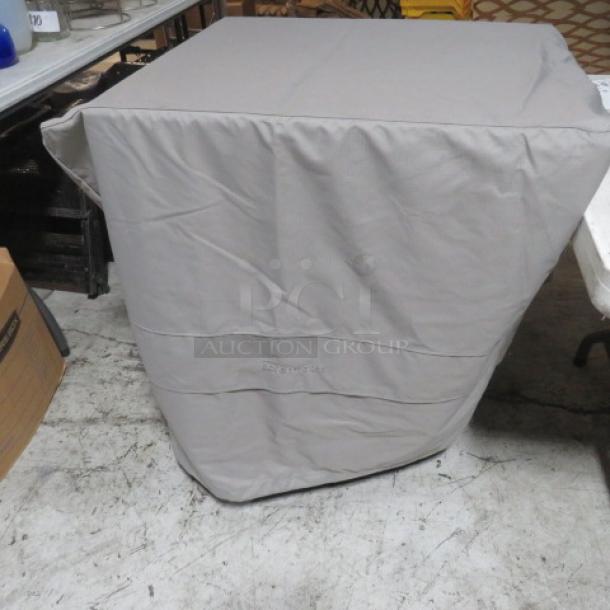 Covermates 36x36 grill cover in light gray, clean and in good condition, with brand name embroidered on the front.