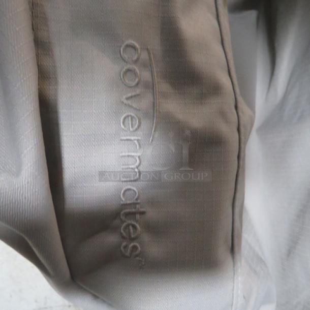 Covermates 36x36 grill cover, light gray, with embossed logo. Appears in good condition. Model 2XBID visible.