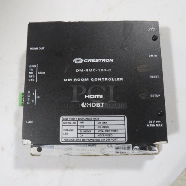 Crestron DM-RMC-100-C DM Room Controller, HDMI, HDBaseT, black, visible ports and diagnostics label, used condition.