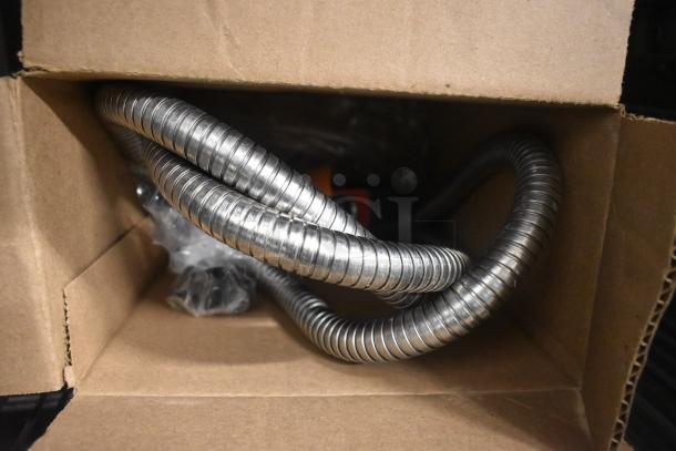 Coiled metal tubing inside a cardboard box, part of Blodgett HVH-100E oven components.