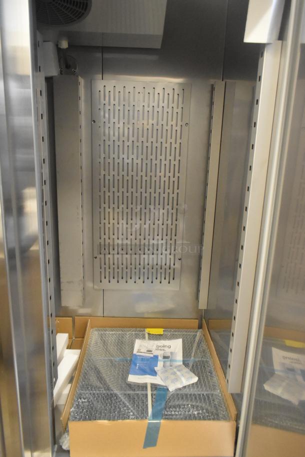 Brand new Avantco 178SS2FHC 2-door commercial freezer, scratch and dent, interior view with packaging materials.