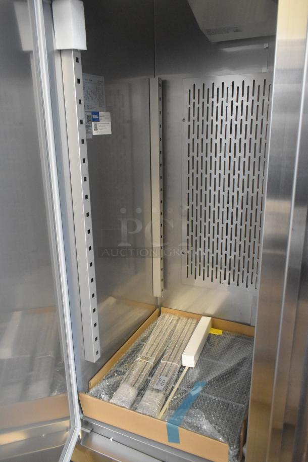 Brand new 2025 Avantco 178SS2FHC commercial freezer interior showing shelves and packaging. Scratch and dent condition.