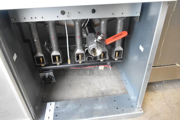 Brand new Dean SR162GN commercial deep fat fryer, natural gas-powered, 150,000 BTU, with 2 metal fry baskets, visible red drain lever.