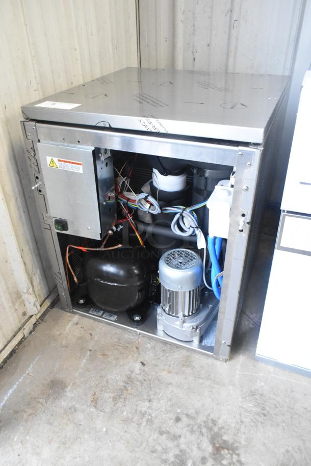 Brand new Manitowoc RNP0620A-161 nugget ice machine, 591 lb capacity, 115V, 1 phase, exposed internal components, minor dents.