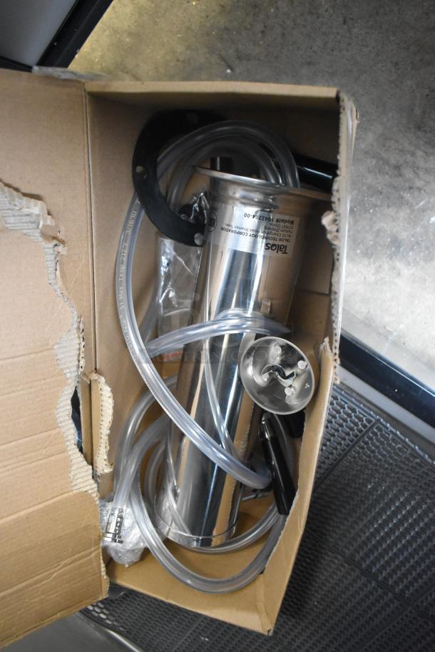 Brand new Avantco 178UDD60HCS beer dispenser parts in open box; stainless steel, tubing visible, slight box damage.