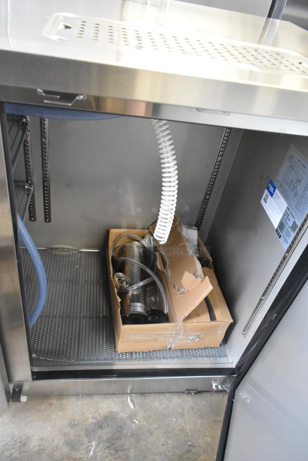 Brand new Avantco 178UDD60HCS double tap kegerator, stainless steel, holds (2) 1/2 kegs, 115V, visible internal components.