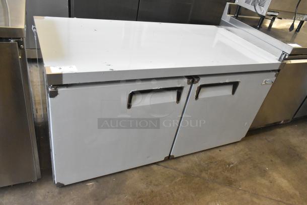 Brand new Avantco 178AU60R commercial 2-door undercounter cooler, 115V, 1 phase, some scratches and dents visible.