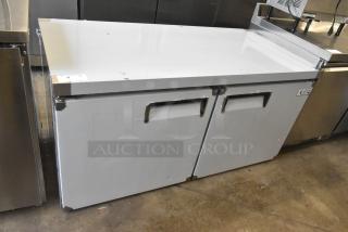 Brand new Avantco 178AU60R commercial 2-door undercounter cooler, 115V, 1 phase, some scratches and dents visible.