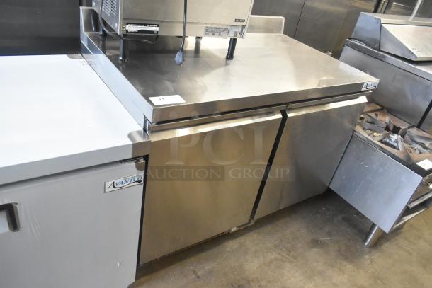 Brand new Avantco 178ZWT48FHC commercial undercounter freezer. Two doors, front breathing, 115V, slight dents visible.