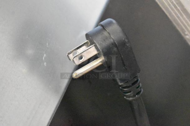 Close-up of the power plug for the Avantco 178ZWT48FHC commercial undercounter freezer.