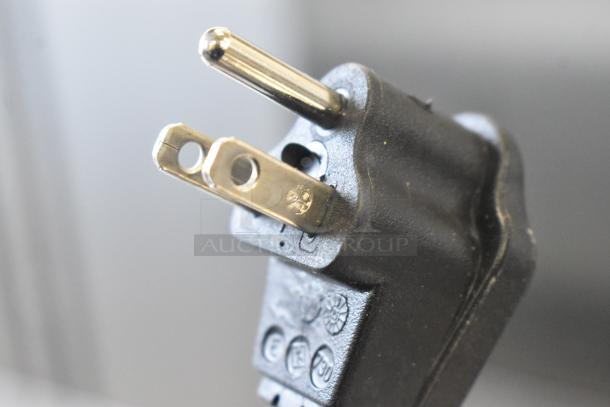 Close-up image of the plug for a Vollrath VBBD3-37-F beverage dispenser, showing a 3-prong electrical connection.