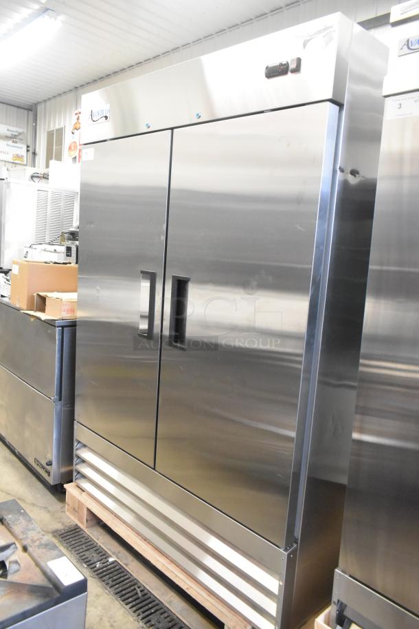 Brand new Avantco 178A49RHC 2023 commercial 2-door reach-in cooler, 115 volts, 1 phase, minor scratches and dents visible.