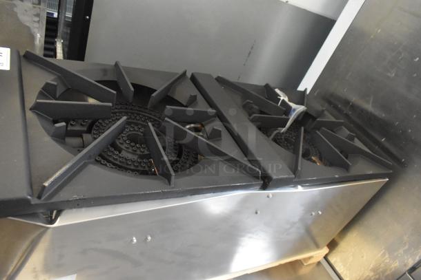 Brand new Cooking Performance Group CPG-DSPR-L stock pot range, 160,000 BTU, liquid propane, minor scratches and dents visible.