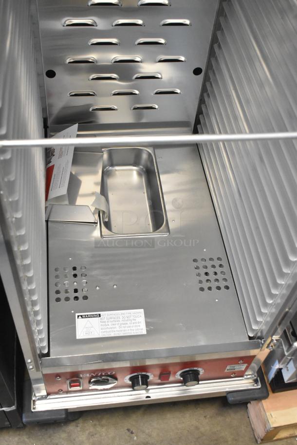 Brand new Avantco HPI-1836 heated cabinet, clear door, insulated, commercial casters, 115V, tags showing settings and warnings.